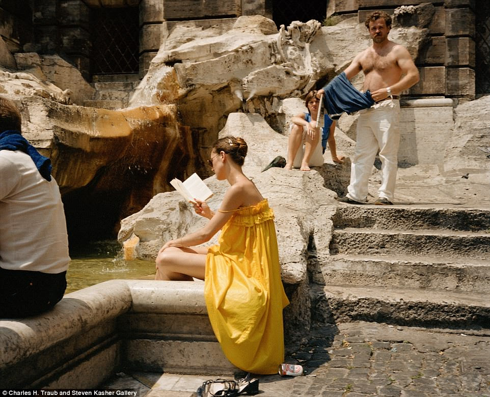 A woman is absorbed in a book as she cools her feet in Rome's Trevi Fountain in 1981. This monument was made famous in Fellini's 1960 La Dolce Vita, which showed Anita Ekberg cavorting in the water