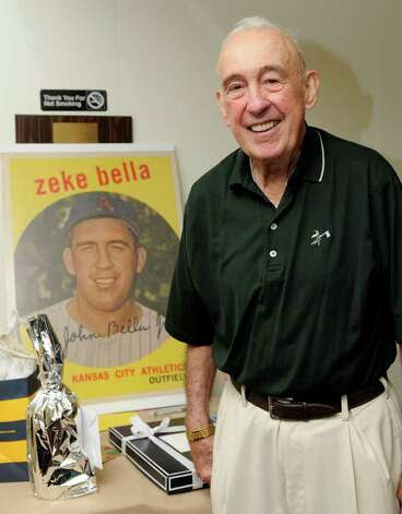John "Zeke" Bella, former outfielder for the New York Yankees and Kansas City Athletics, stands in front of a replica of his baseball card. Bella celebrates his 80th birthday with friends and family at the St. Lawrence Club in Cos Cob, CT on Sunday August 22, 2010. Photo: Shelley Cryan / Shelley Cryan Freelance