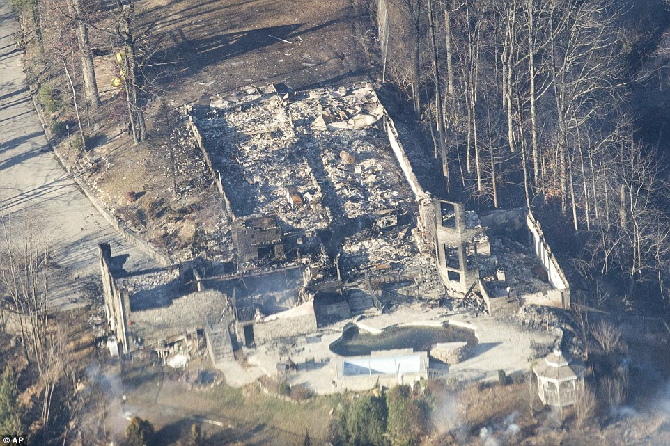 Burned structures are seen from aboard a National Guard helicopter near Gatlinburg, Tennessee on Tuesday