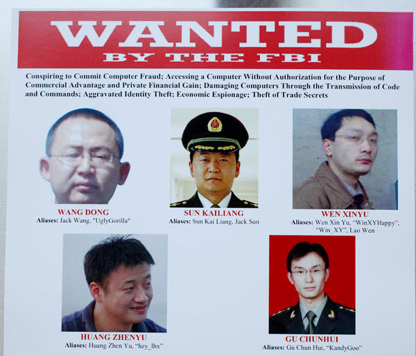 美国司法部的一张海报。图中是本周被控对美国企业进行黑客攻击的五名男子。据推测，中国企业是这些黑客行动的受益者。