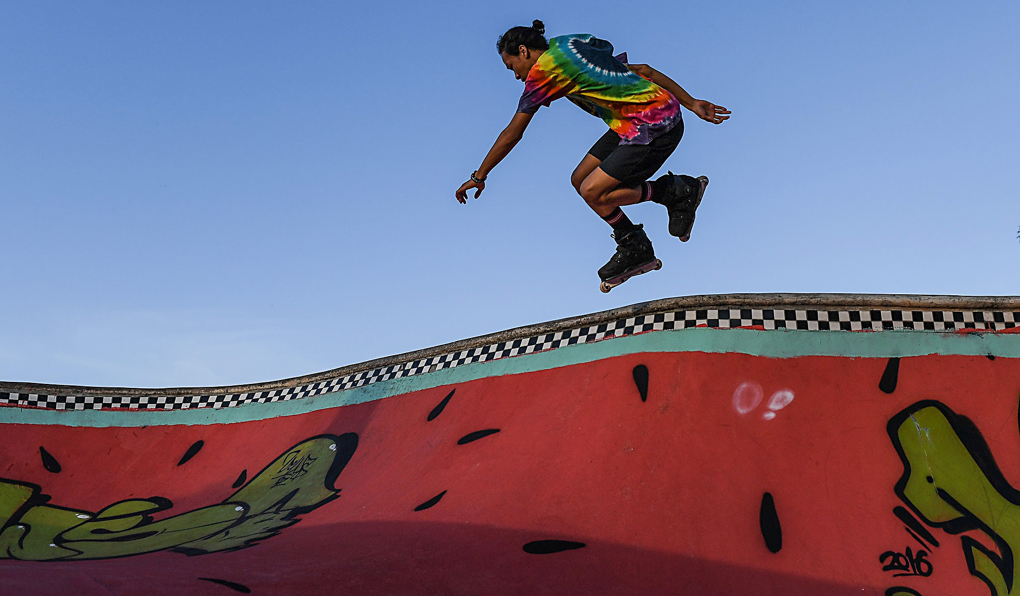 A Malaysian youth jumps while inline skating at a park in Shah Alam, outside Kuala Lumpur