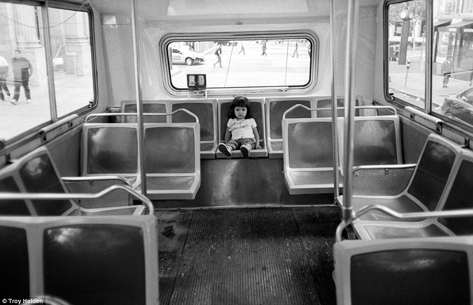 Little passenger: This young San Franciscan sits on the back of the bus going up one of the city's historic inclines