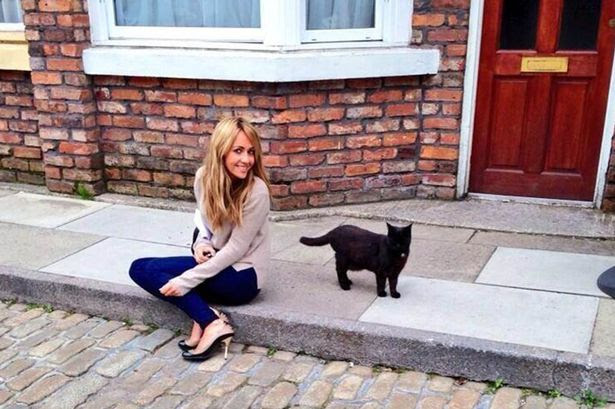 Sweet treat: Samia poses with cute Corrie cat