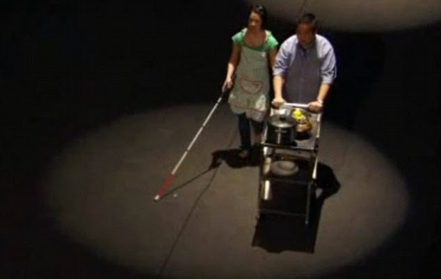 First blind contestant: Christine Ha arrives on the Masterchef set using her cane and the help of husband John 