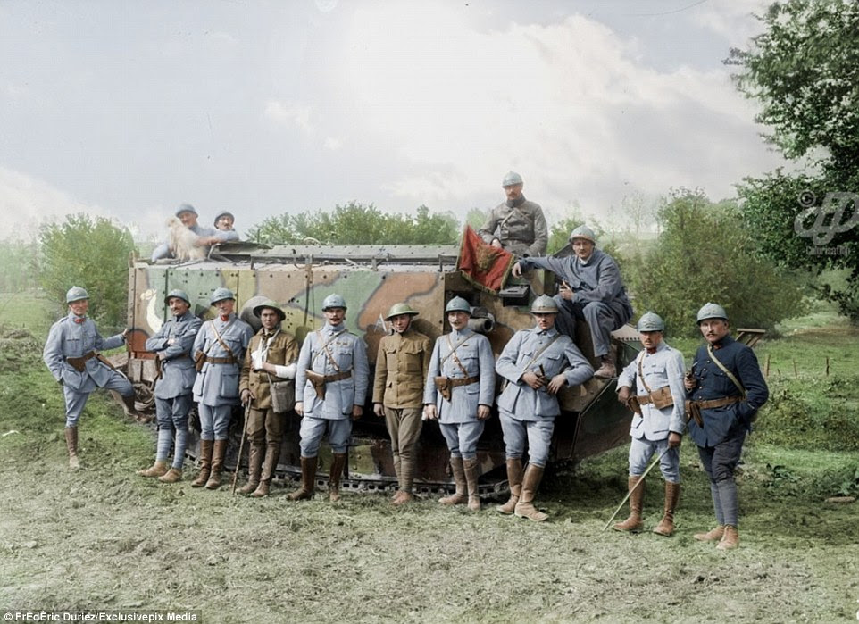 French and American officers who took part in the reconquest of Cantigny stand in front of a Schneider French tank in May 1918. The armoured fighting vehicle is still viewed today as the first French tank, even though it was not turreted