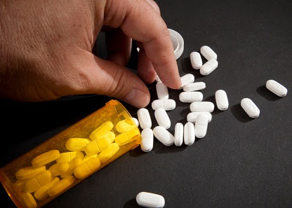 Taking Narcotic Pills, a leading prescription drug that is abused.