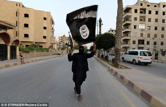 Dark shadow: The jihadi dream of a return to a world split into two violently divided rivals — into a 'House of Islam' and a 'House of War' — no longer seems such a fantasy as once it did. Above, an ISIS fighter in Syria