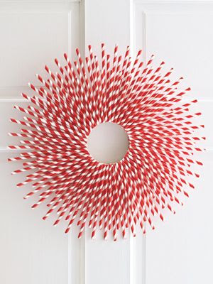 modern xmas wreath made out of red and white striped straws
