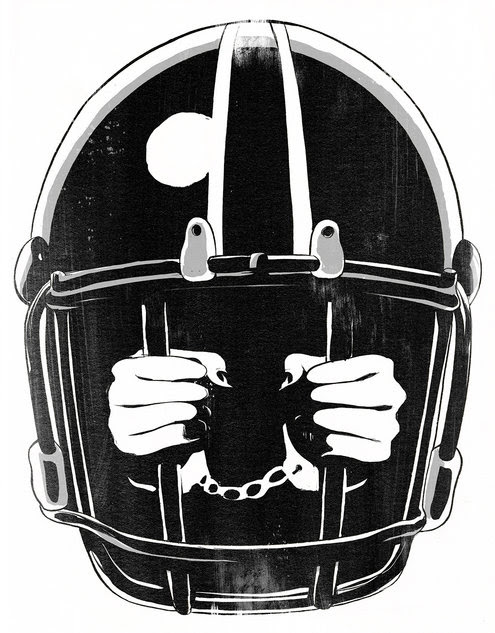 Hands in chains reaching through the bars of a football helmet facemask