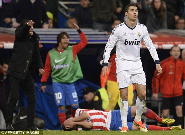 Look of innocence: Cristiano Ronaldo was sent off late in the game for kicking out at Atletico Madrid midfielder Gabi