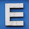 E E