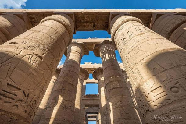 The 134 gigantic                  columns in the Great Hypostyle Hall at Karnak Temple                  complex stand testament to a glorious bygone age when it                  was a pilgrimage spot for over two millennia. A clump of                  12 open papyrus capitals here may have been intended to                  symbolize the primordial 'mound of creation'. This was                  the abode of the state god, Amun-Ra. Modern-day Luxor.