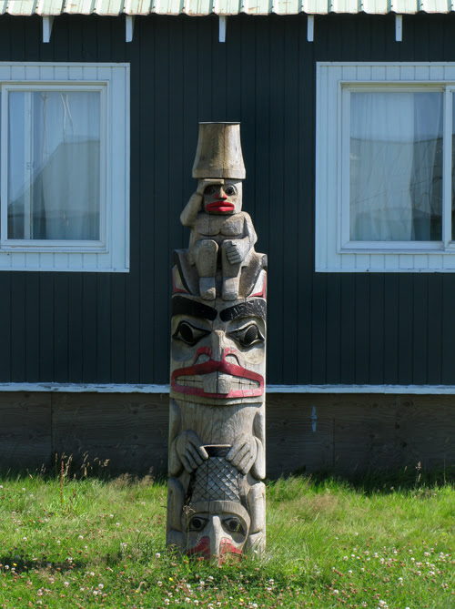 totem in front of Claude Morrison's house, Hydaburg, Alaska