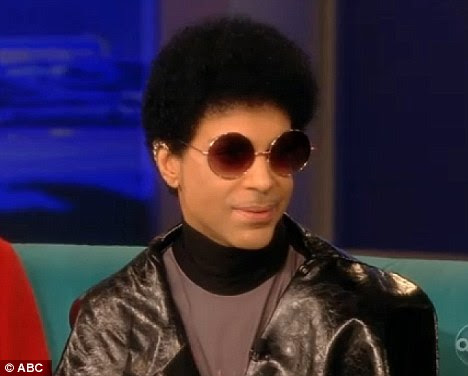 Natural look: As Prince strutted onto The View today with his yellow-high-heeled boots, the musician debuted his new small afro