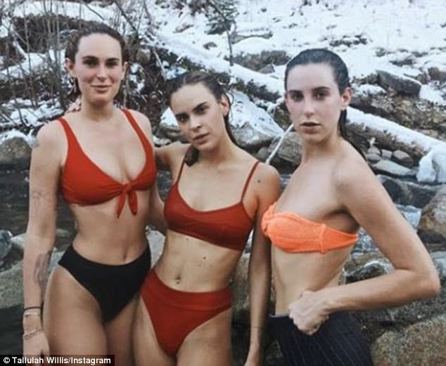 Cold: Rumer, Scout and Tallulah all stropped down to their bikinis for a striking image by a river