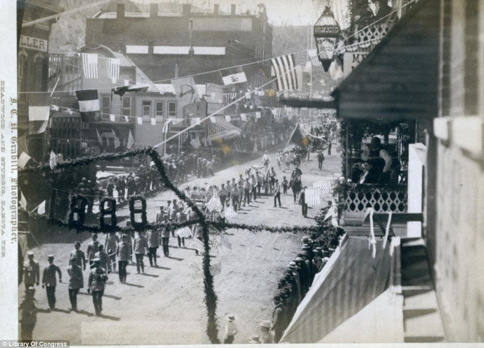 Progress: The people of Deadwood celebrate the completion of a stretch of railroad in 1888 with a parade along the town's Main Street