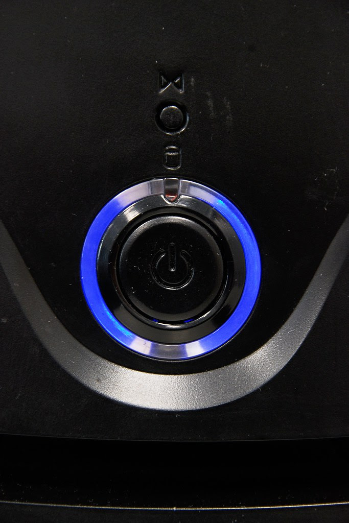 A blue ringed power button.