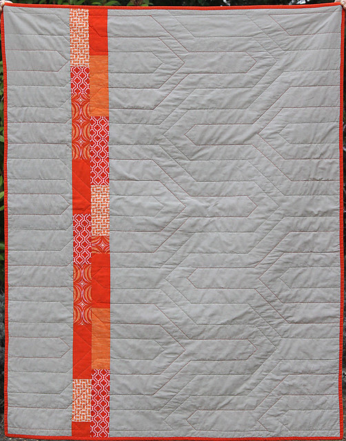 Back view of the Modern Chevron Baby Quilt, showing the quilting pattern 