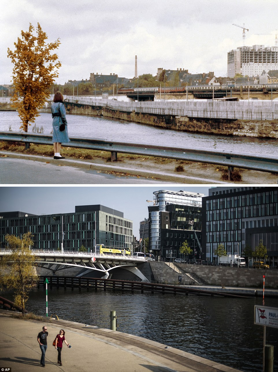 A river runs through it: A woman looks out across the Spree river at the Berlin Wall in 1980, with construction work taking place at the Charite hospital in background. Today a bridge links the two sides of the river, which has a number of modern buildings along its banks