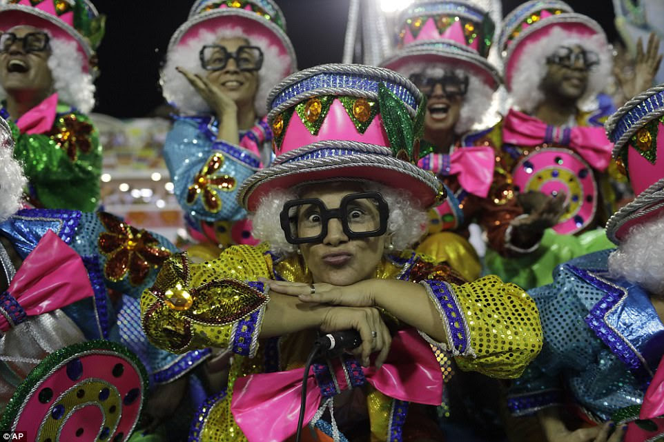 Dancers wore multi-coloured outfits as the paraded through the Sambadrome in Rio de Janeiro - watched by 72,000 spectators