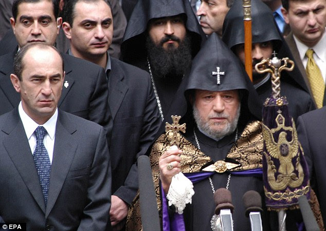 Former Armenian President Robert Kocharian (Left) takes part in the ceremony at the Genocide Memorial complex in Yerevan
