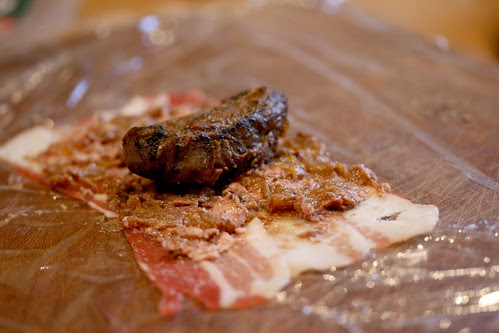 Pig cheek being wrapped