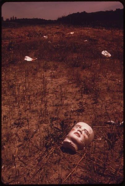 File:A BROKEN DOLL'S FACE BY THE RIVER EDGE-SILENT COMMENTARY ON MAN'S USE OF NATURE AS A JUNKYARD. NEAR THE 7TH STREET... - NARA - 552078.tif