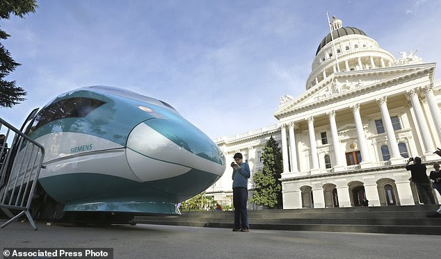 After years of prep work, California Governor Jerry Brown's administration decided it was time to begin work on the state's high-speed rail in the Central Valley  on Friday. Pictured: A full-scale mock-up of the fast train displayed at the Capitol in Sacramento, California