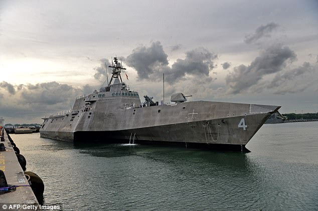 The Navy's Littoral Combat Ships (LCS) don't have the fire power to hit anything more than a few miles away, and 'are not expected to be survivable in a hostile combat environment,' according to the Government Accountability Office. A LCS is pictured in Singapore October 2016