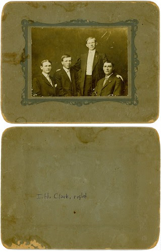 Four men in suits with reverse