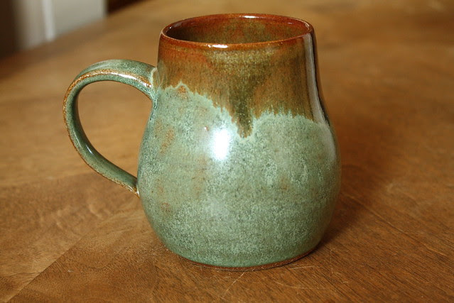 green & brown pear-shaped mug