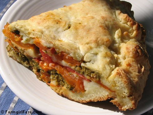 Savory tomato, mozzarella, and basil pesto pie with an easy cheesy biscuit crust