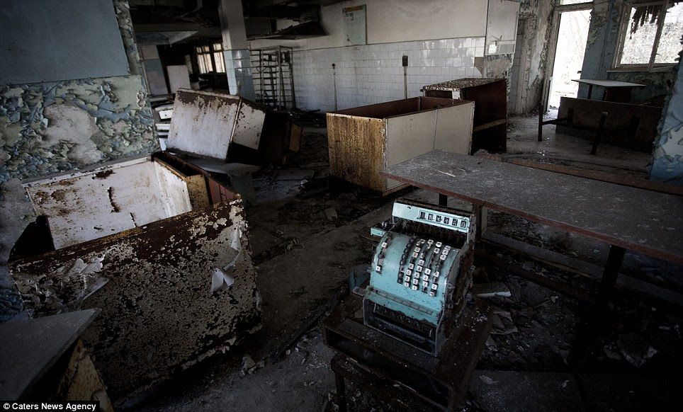 Back in time: The canteen in a school in Pripyat still boasts a cash register amid the terrible decay 