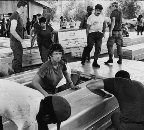Members of a US military team prepare aluminum coffins for shipment to the United States, following the more than 900 deaths in the mass suicide staged in Jonestown by members of the People’s Temple and their leader, the Reverend Jim Jones, Georgetown, Guyana, November 24, 1978.