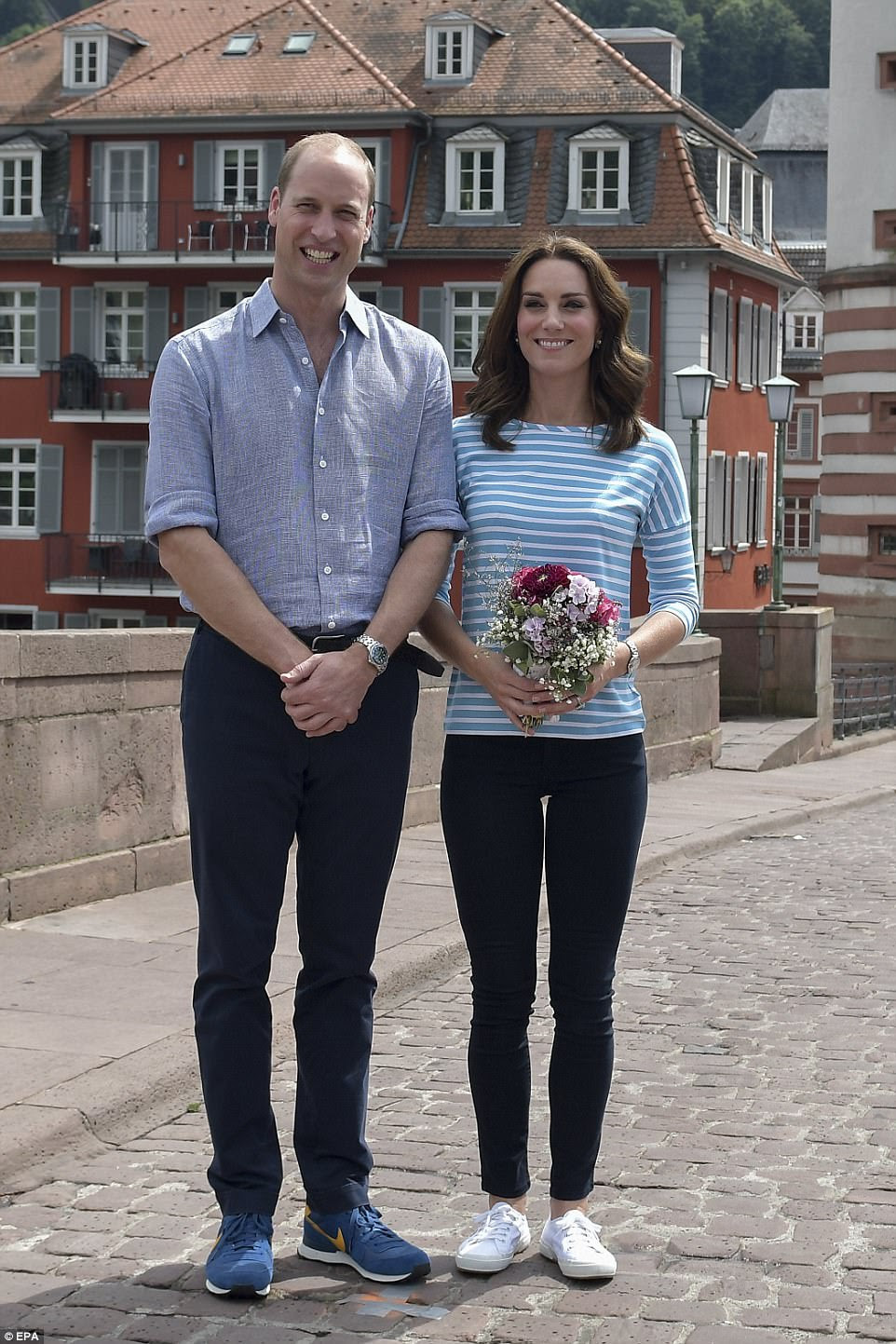 No hard feelings! Kate and William pose for a photo after the Duchess' team was beaten by her husband's, despite having an Olympic rower on her side. The Duchess turned once again to her trusty £55 Superga trainers
