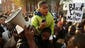 Ten-year-old Robert Dunn uses a megaphone to address