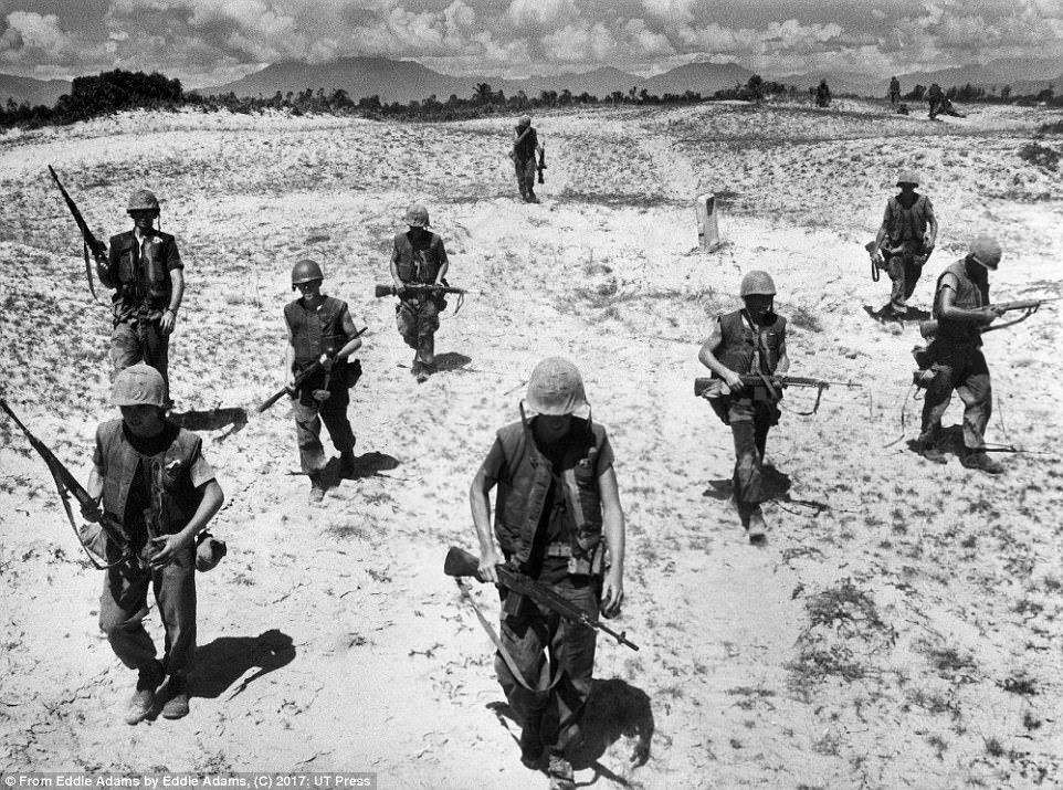 Adams captured unidentified soldiers walking in Hoai Chau, Vietnam, on January 31, 1966 during the Vietnam War