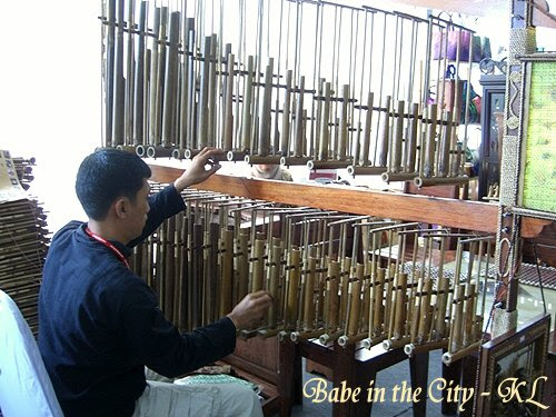 Man playing angklung - view from back