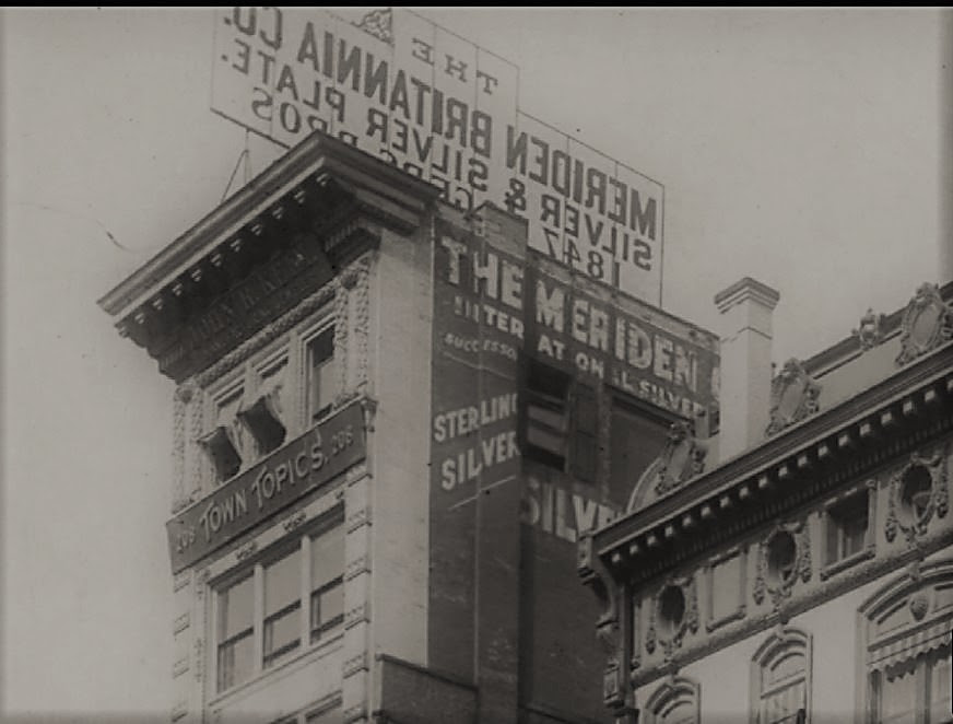 In this closeup of the top floors of 208 Fifth Avenue, you can see the marquee for Town Topics and the windows from which The Laird and Little Billee made their fatal leaps to the pavement below.