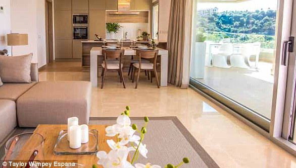 The open-plan living areas include a kitchen and cream-coloured marble flooring