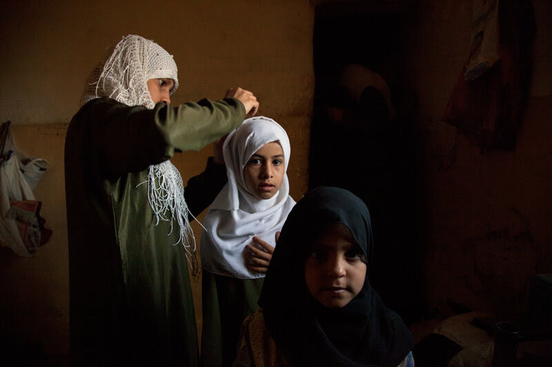 Girls in Sadah get ready for school.