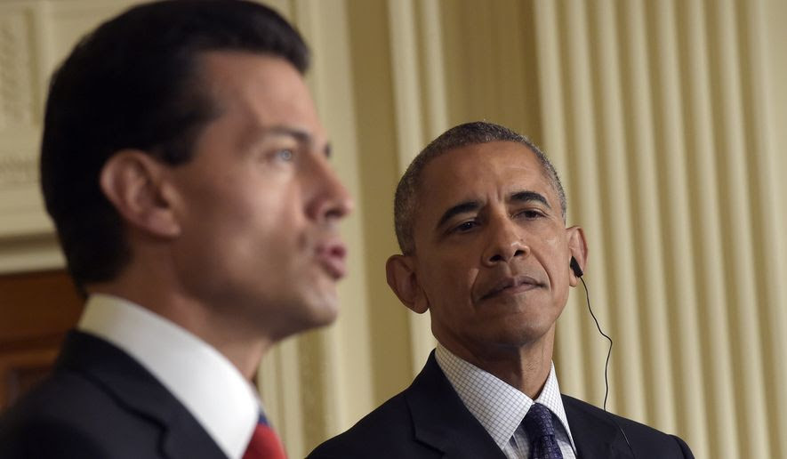 President Barack Obama, right, listens as Mexican President Enrique Pena Nieto, left, speaks during a news conference in the East Room of the White House in Washington, Friday, July 22, 2016. Obama says he has worked to deepen the U.S. relationship with Mexico and that the two countries are not just strategic and economic partners, "we're also neighbors and we're friends." (AP Photo/Susan Walsh)
