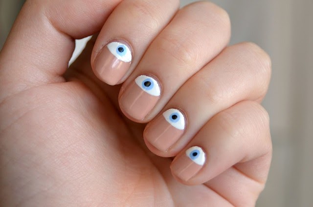 7. "Step-by-Step Tutorial for an Evil Eye Nail Design" - wide 2