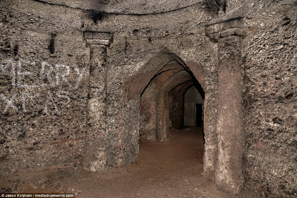 The haunting shots show a series of hidden passages, structural columns adorned with graffiti and rubble that has crumbled from the temple's roof