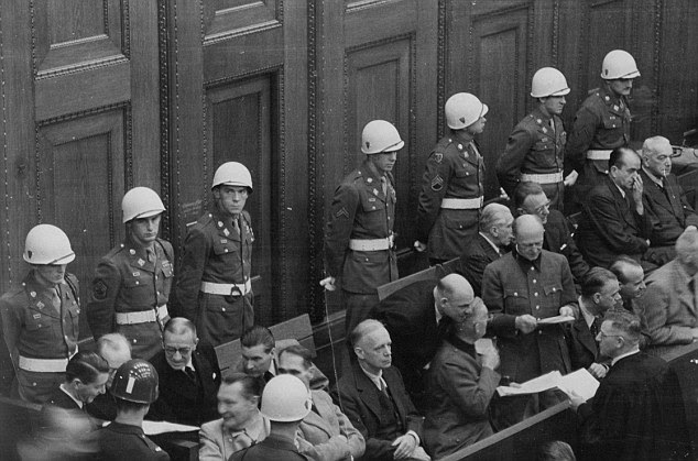 Flashback: The prisoners in the dock are Nazi leaders Hermann Goering and Rudolph Hess - it is unknown how they might have been treated in prison