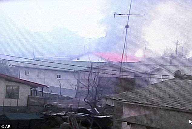 Fire: Several houses are ablaze on the island, where between 1,200 and 1,300 people live