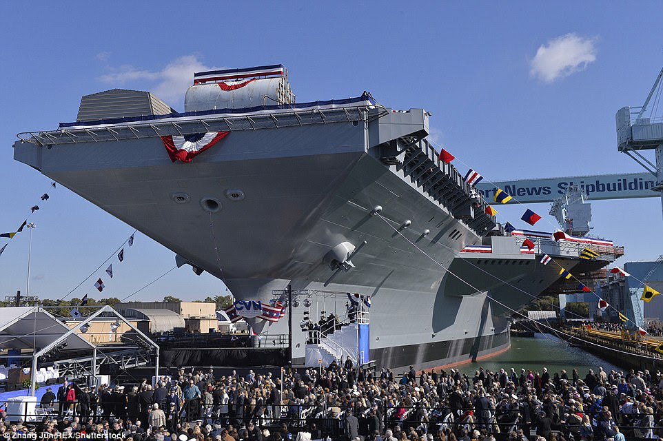 Pictured is the scene during the christening ceremony for the aircraft carrier on November 9, 2013
