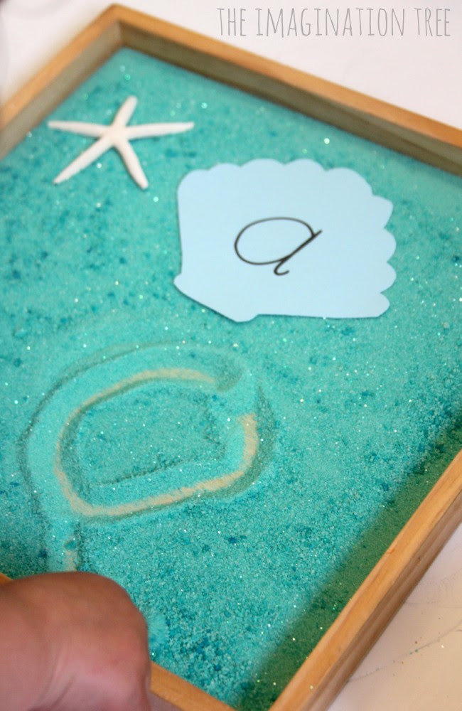 Learn letters in an ocean themed sensory tray