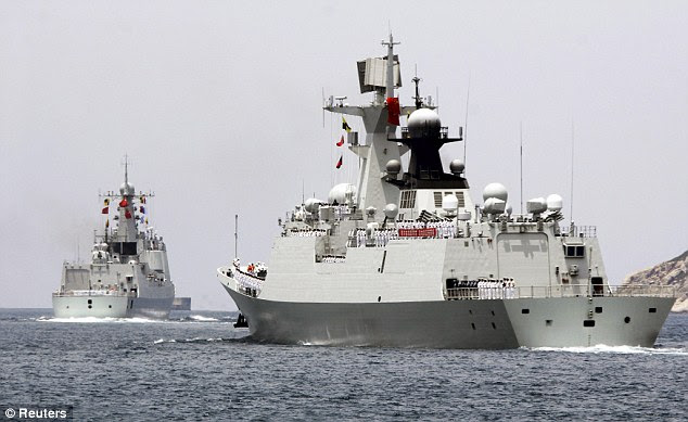 Chinese naval destroyer Haikou (L) and missile frigate Yueyang depart for the Rim of the Pacific exercise (RIMPAC), at a military port in Sanya, Hainan province June 9, 2014. China on Monday confirmed that it will participate for the first time in a major U.S.-hosted naval drill this month, sending four ships including a destroyer and frigate, even as deep military distrust persists between the two countries. Picture taken June 9, 2014. REUTERS/Stringer (CHINA - Tags: MILITARY POLITICS) CHINA OUT. NO COMMERCIAL OR EDITORIAL SALES IN CHINA - RTR3SZJC