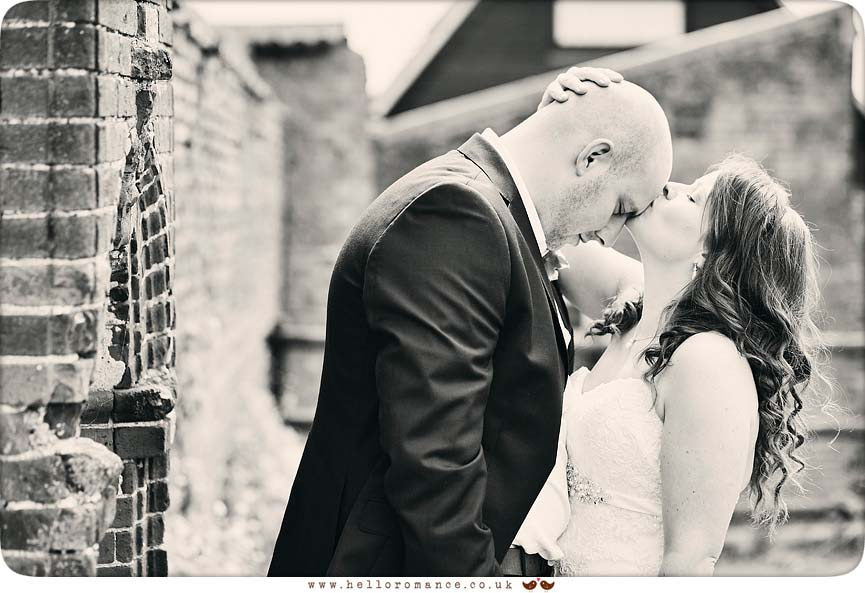 Black & White photo of bride kissing groom's head - www.helloromance.co.uk